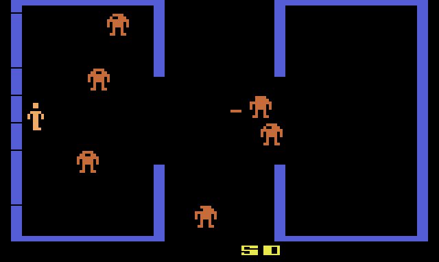 The next room with orange robots, one of them firing.