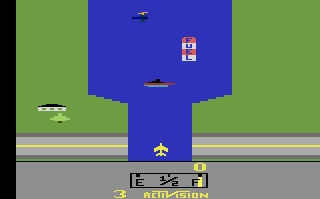 River Raid's opening screen: the river between green banks, a helicopter, a fuel depot and a ship ahead, a house on the bank, the jet on the road and the status bar with score, fuel gauge and lives.